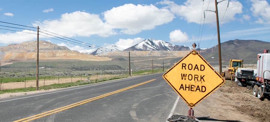 Road with Road Work Ahead Sign