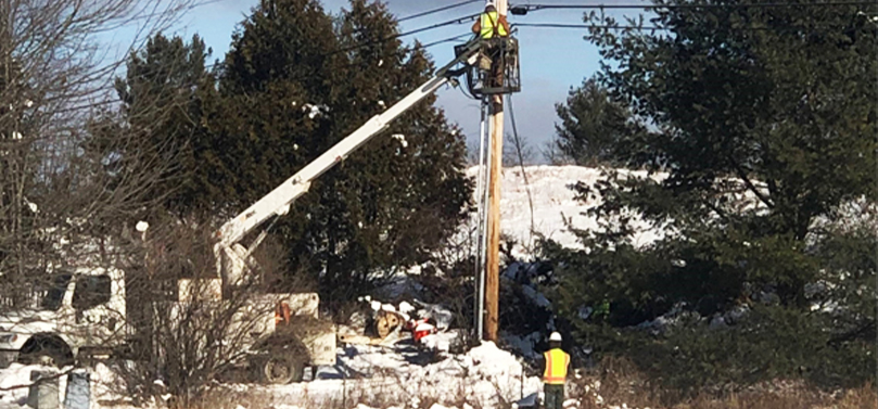 Tilson Crew Fixing a Wire on a Power Line